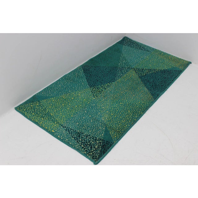 This rug from the 1970s remains in a good original condition.