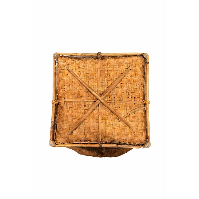 Beautifully handwoven vintage round basket crafted from natural reed, featuring a tight plain weave, reinforced wrapped...