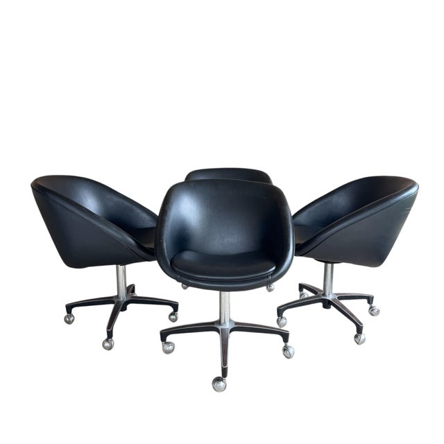 Fantastic set of 4 1960's black swivel pod chairs on casters, each with the original tag under the seat to verify they...