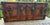 A handsome late 19th-century American flat-top travel trunk featuring warm, aged wood accented by original hand-riveted...