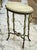 Bring distinctive character to your interior with this one-of-a-kind French-inspired side table. Its elegant oval tabletop...