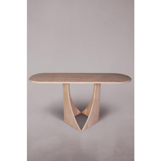 Introducing our exquisite Travertine Console Table featuring legs reminiscent of penguin feet. Crafted with precision and...