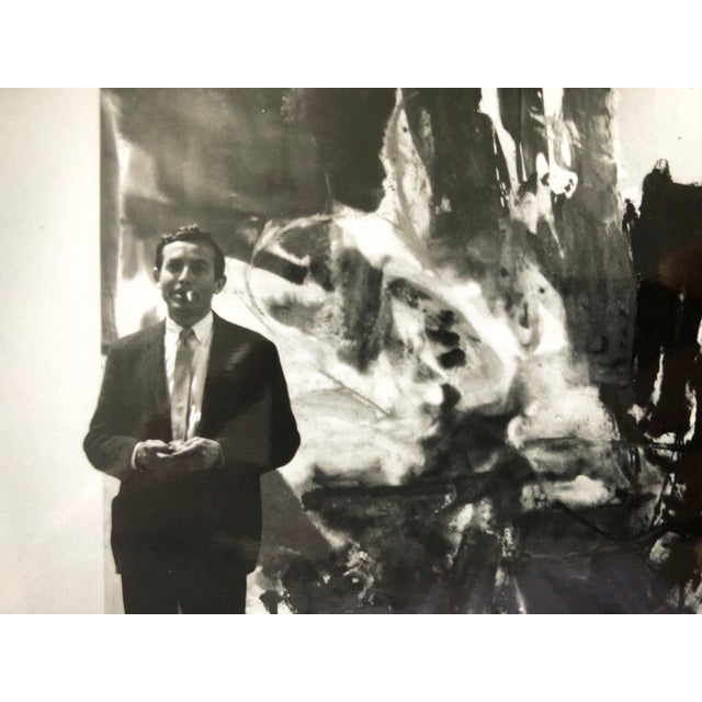 This is a photo of Friedl Dzubas (Abstract Expressionist) at Castelli Gallery, signed in ink and with photographer stamp...