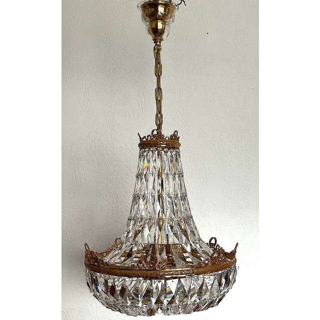Brass and Lead Crystal 9-Flame Chandelier from Palwa, 1960s, in Very Good conditions. Designed 1960 to 1969 This piece has...