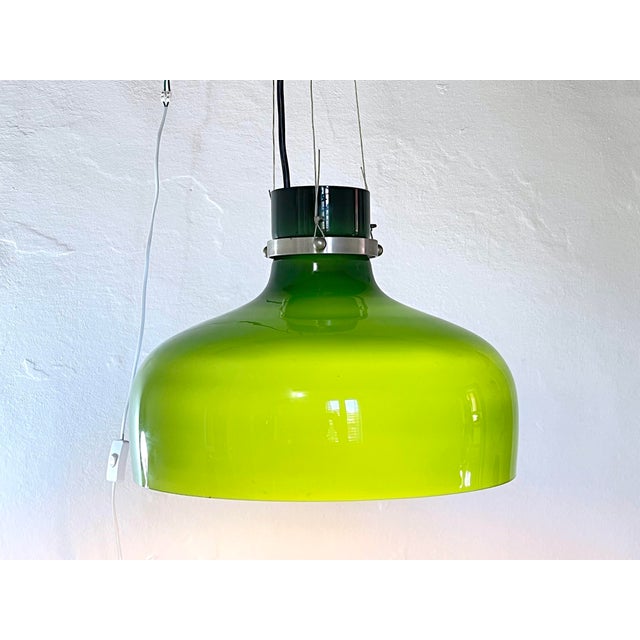 Superb large Murano glass pendant light with a very long hanging cable. The glass is green on the outside and white on the...