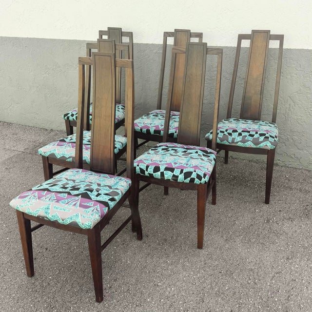 A refined set of six mid-century modern dining chairs by Stanley Furniture, crafted in rich walnut with beautifully...