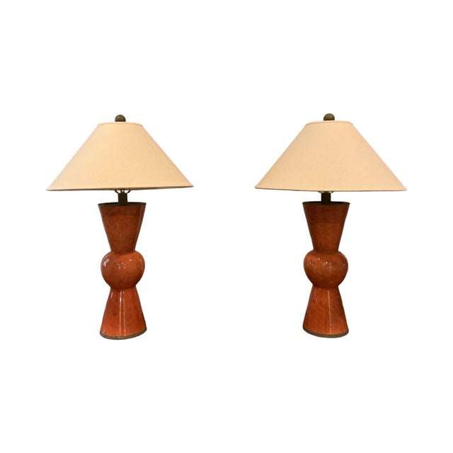 Currey & Company Upbeat terracotta table lamps. Lamps have a round ball center with extended cone shapes creating modern...