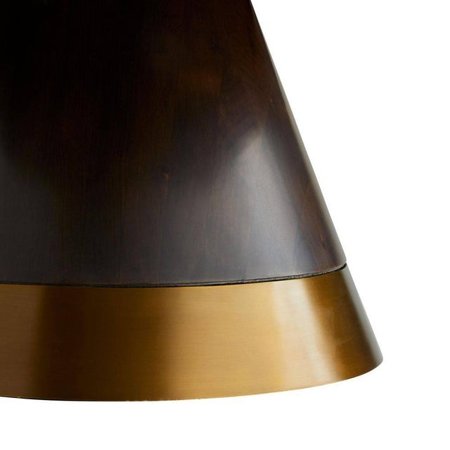 Geometric shapes and defined lines make this a notable coffee table. A rich brindle finish graces the eucalyptus veneer...