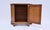 A console cabinet or commode by Baker Furniture, circa 1960s of French cherry wood with a single raised panel door and one...
