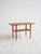 Made by Alberts Tibro (Sweden), 1960s. Teak coffee table with a contoured top, tapered legs, and a lower shelf made of...