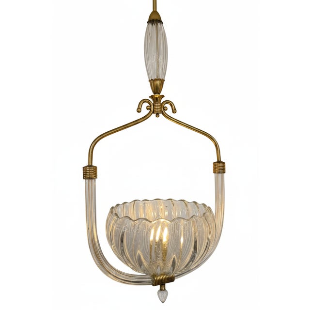Lovely, Murano glass pendant by Barovier & Toso; All hand blown clear glass with brass details. These are acquired buy a...