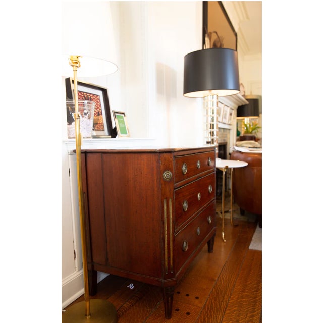 Molded top over canted and fluted case sides with brass trimmed drawers, ring pulls, and tapered feet. 33.5" W x 20.5"D X...