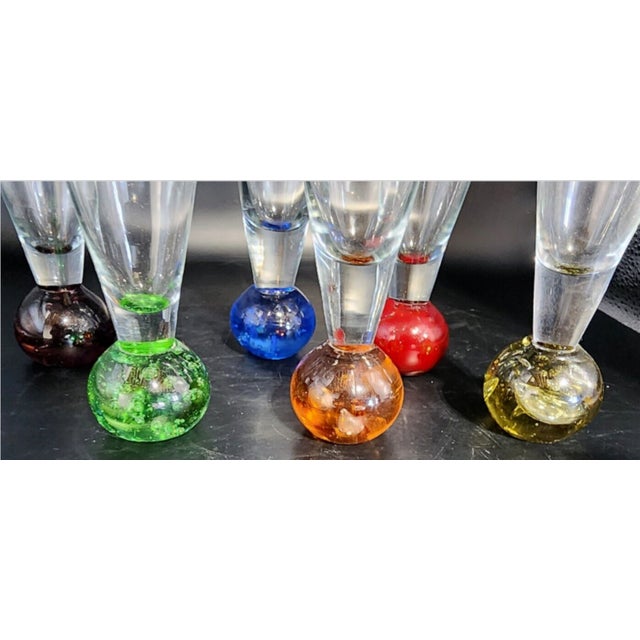 Very nice set of 6 cordials, each with a different colored controlled bubble base - violet, orange, green, blue, red and...