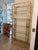 Etagere made entirely of high-quality brass in a beautiful gold color with five clear glass l-tops that together create a...