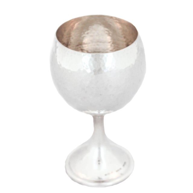 This sterling silver hand hammered goblet is made by and signed “Buccellati Sterling”. It is modern and still elegant. The...