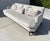 Elegant 100” Baker Celestite sofa upholstered in light gray/silver performance velvet. Designed by Jean Louis Denoit from...