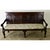 Dimensions: 39 ⅞” H x 72 ¼” W x 26 ¼” D A circa 1780 English oak "settle bench" (hall bench) of stately carved details....