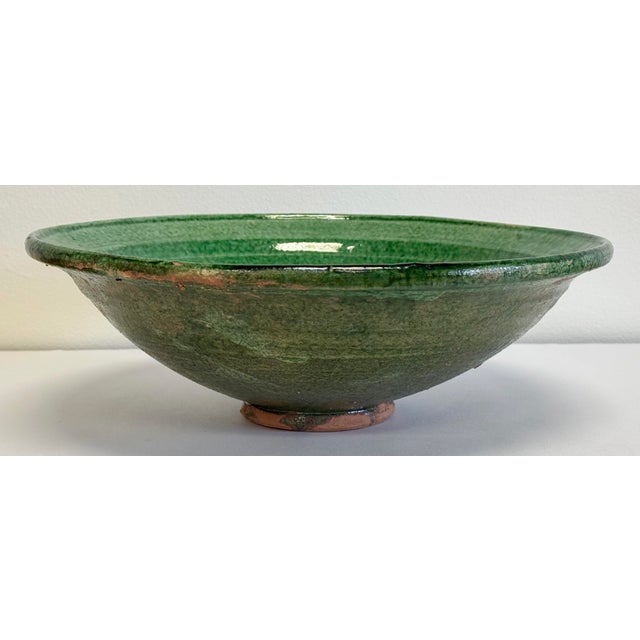 Beautifully hand-thrown painted ceramic bowl from the late 20th century, Pakistan glazed in a vibrant asparagus green....