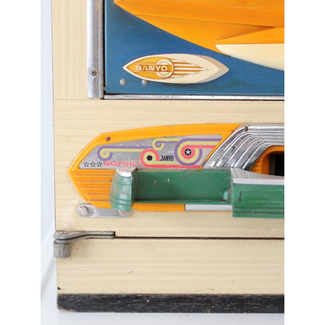 This vintage 1970s Sanyo Comet II pachinko machine is a striking fusion of mid-century mechanical design and vibrant...