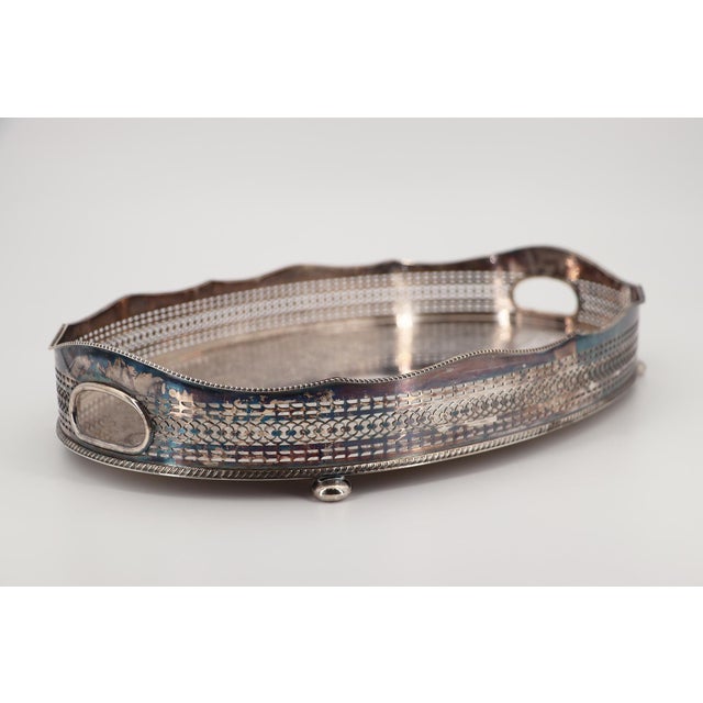 Origin: English. Circa: 1940. Marked: Barker Ellis. Item condition: This Barker Ellis large English silver-plated footed...