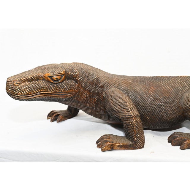 Stunning hand carved komodo dragon sculpture Eclectic piece, great as a decorative piece Good size at almost three feet...