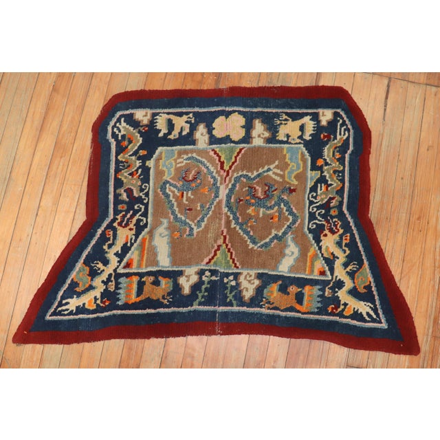 An early 20th century Tibetan dragon horse cover textile rug, circa 1900, measures: 2'5" x 4'.