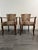 This striking pair of French 1940s armchairs balances mid-century architectural elegance with a bold, maximalist touch....