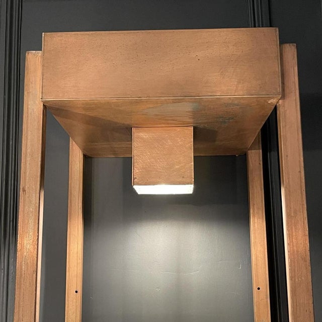 Industrial style copper plated steel "column" shelf, 1970's Brutalist design. Composed of 4 levels including 3 shelves in...