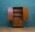 Beithcraft tallboy in walnut veneer with bookmatched grain and shaped panel doors in an Art Deco style. Original drop...