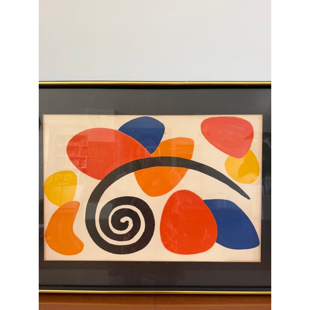 Vintage Alexander Calder folio lithograph featuring the artist's iconic vocabulary of bold primary color, biomorphic...