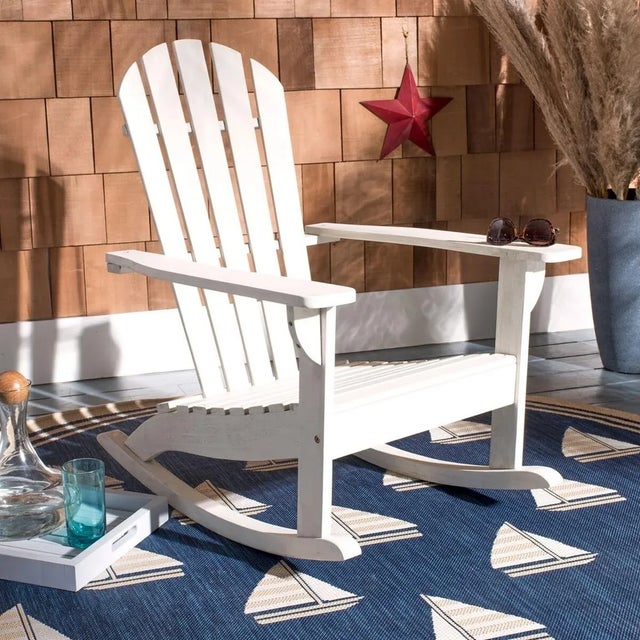 Go on, relax and sit for a spell. This traditional Adirondack rocking chair was created for those who enjoy the outdoors...