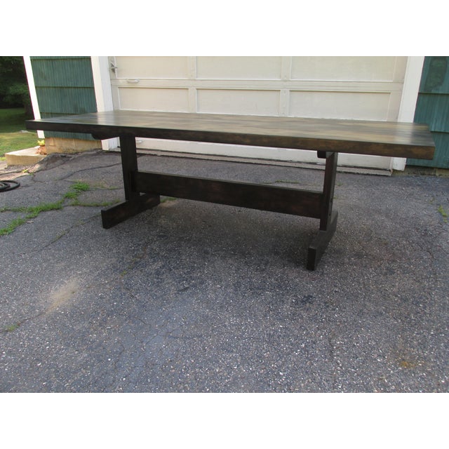Mid Century trestle style dining table possessing beaucoup gravitas. Two and a quarter inch thick multi-plank maple top...