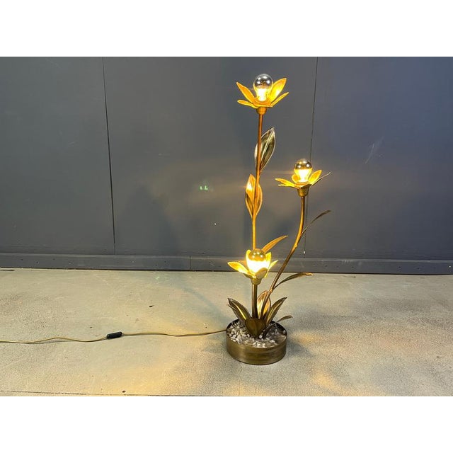 Beautiful torch cut brass lotus flower floor lamp by Maison Jansen. Three light sources. Base is made from brass and...