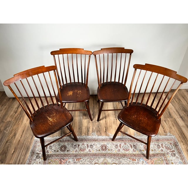 A handsome and increasingly scarce set of four early 19th century New Hampshire Windsor chairs, signed J.R. Hunt,...