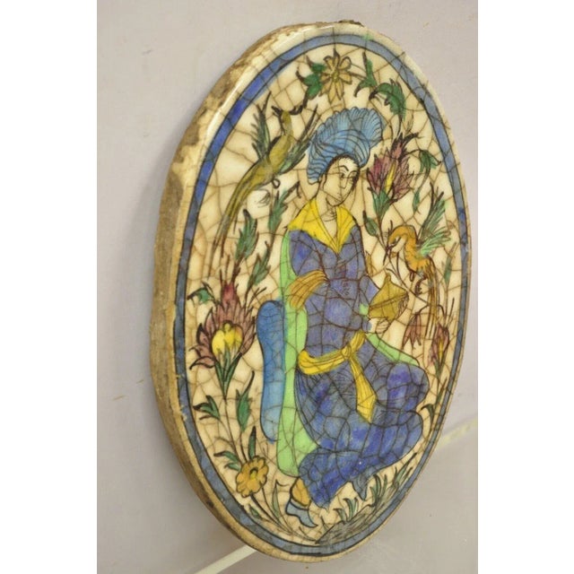 Early 20th Century Antique Persian Iznik Qajar Style Ceramic Pottery Oval Tile Figure With Bird C3 For Sale - Image 5 of 10
