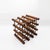 Elegant wine bottle rack crafted from solid precious hardwood, featuring an abstract geometric design characteristic of...