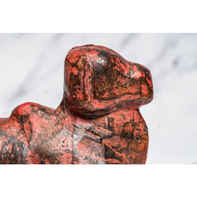 Add a touch of rustic character to your space with this hand-carved wooden figure, finished in layers of aged red and...