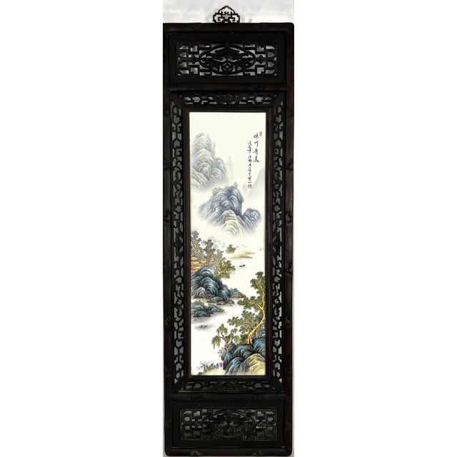 A beautifully hand painted and hand carved Chinese wall panel. The dark brown wood frame is intricately hand carved with...