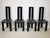 Set of four postmodern dining chairs by Pietro Costantini from the 1970s/1980s. Black lacquered beechwood with...