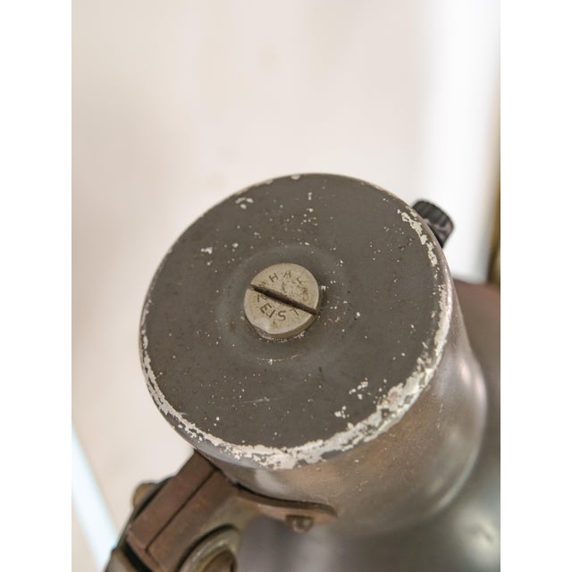 An original scissor lamp by Hala Zeist, carrying the patina of decades spent lighting a working environment. Hala Zeist is...