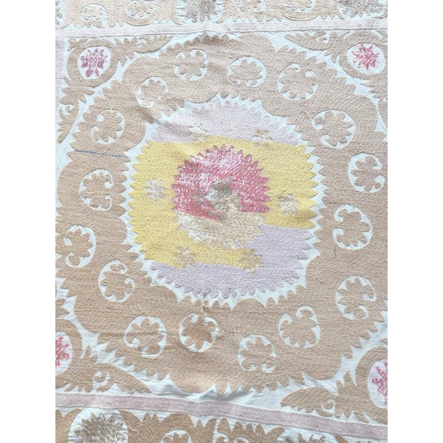 Hand-Embroidered Vintage Suzani from Asian, circa late 1960s. There is some wear on this suzani. Dimension; 48'' x 48''...