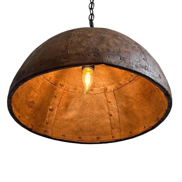 Vintage iron pendant light crafted from a hand-forged bowl from early–mid 20th century India. Such vessels were...