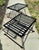 Salterini wrought iron tables with scrolled bases and slat tops. No glass. Circa 1930s. There is no maker's mark but brand...