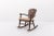 Mid-Century rocking chair produced in Sweden, 1950s. Stained solid pine structure with a loose seat cushion pad. Condition...