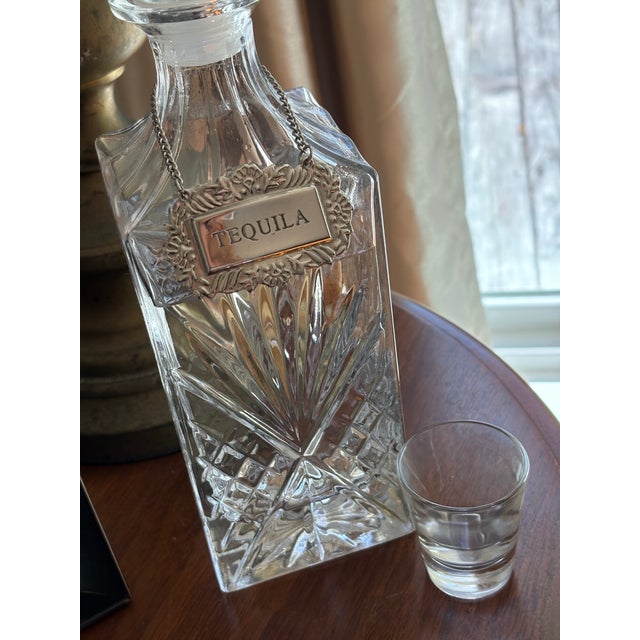 Add a touch of vintage charm to your barware collection with this ornate silver-tone decanter label engraved with...