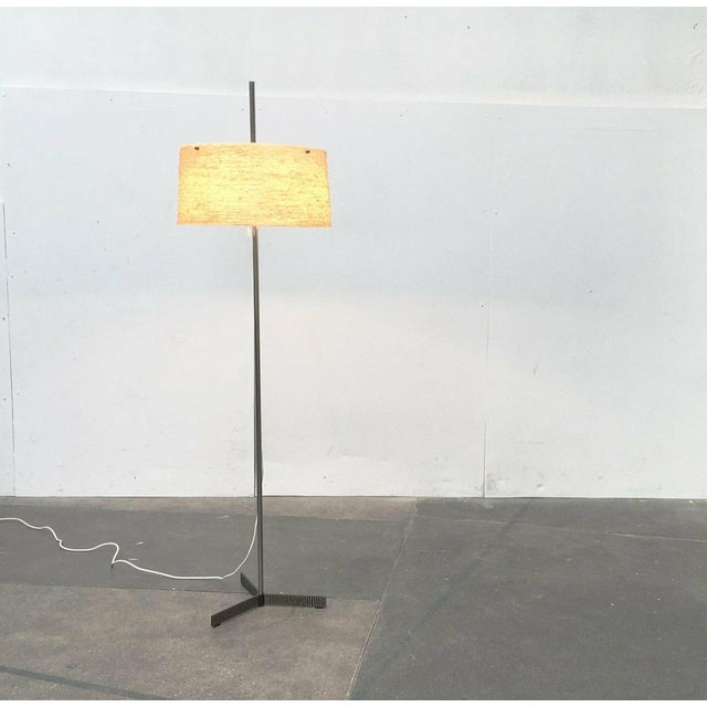 Mid Century standing lamp by Kaiser lights with a special foot. The most distinctive detail of this lamp is the finely...