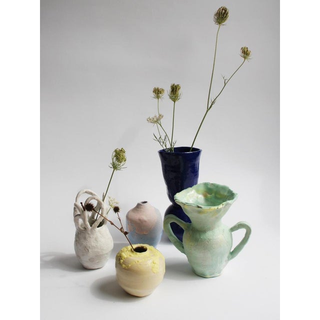 high fired stoneware, decorated with porcelain based engobes, transparent glaze. The MINI Vase is part of a open...