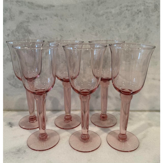 Set of 6 vintage pink handblown wine goblets, likely made in Spain. Characterized by the delicate pink hue and handblown...