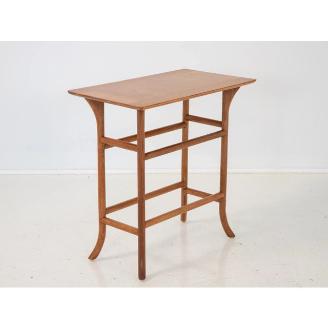 A refined drinks or side table, designed by T.H. Robsjohn-Gibbings for Widdicomb. A mid-century modern design with...