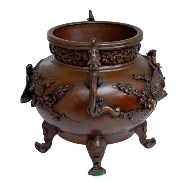 Japanese Bronze Two Handle Koro, early 20th century, with salamander form handles and exotic bird decorated body, on four...